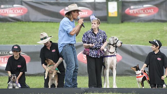 Dave Graham with the other stars, the volunteers, and some of the dogs.