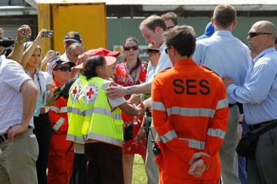 Prince William greets Red Cross volunteers at the Tully Showgrounds Community Hall in Queensland